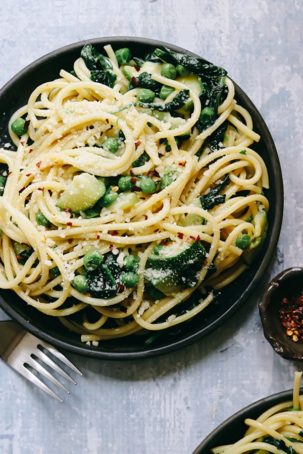 Creamy bucatini with zucchini, peas, and spinach