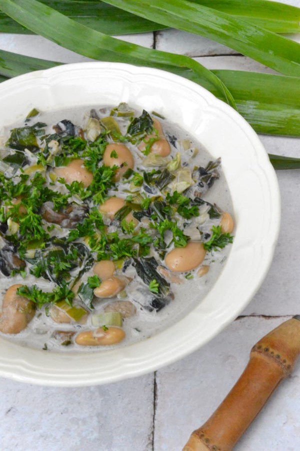 Creamy butter beans with mushrooms and spring greens