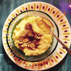 Creamy cardamom rice pudding with almonds and apricots