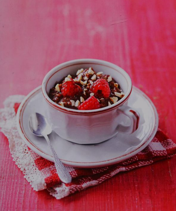 Creamy chocolate rice pot with raspberries and almonds (Risotto al cioccolato)