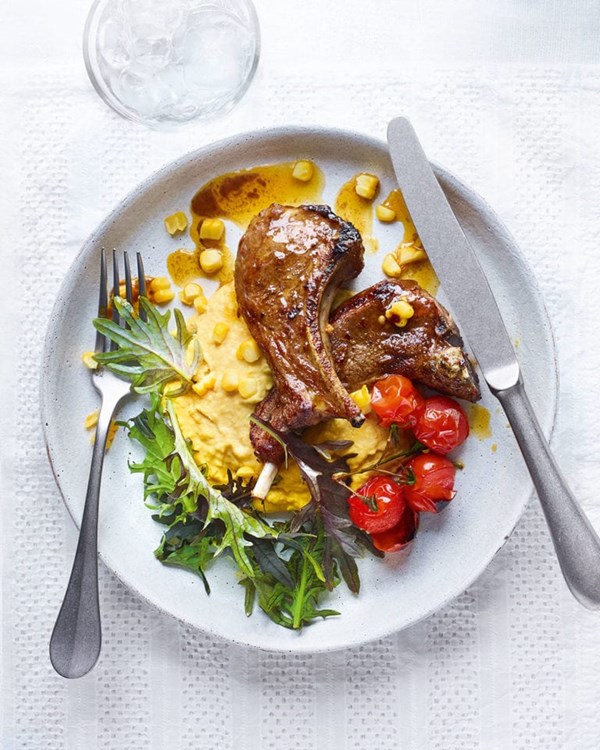 Creamy corn houmous with lamb chops, tomatoes and baby leaves 