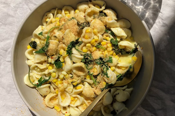 Creamy corn pasta with coconutty greens
