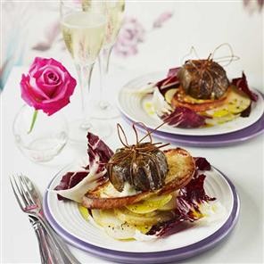 Creamy goat's cheese baked in vine leaves with winter salad