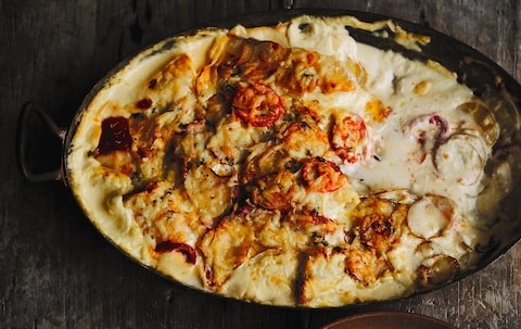 Creamy gratin of smoked haddock, tomatoes and potatoes