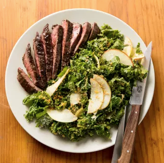 Creamy kale salad with skirt steak