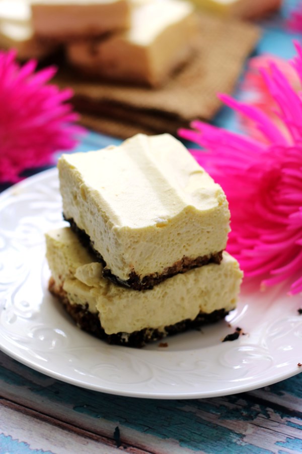 Creamy mango coconut mousse bars with a coconut shortbread crust