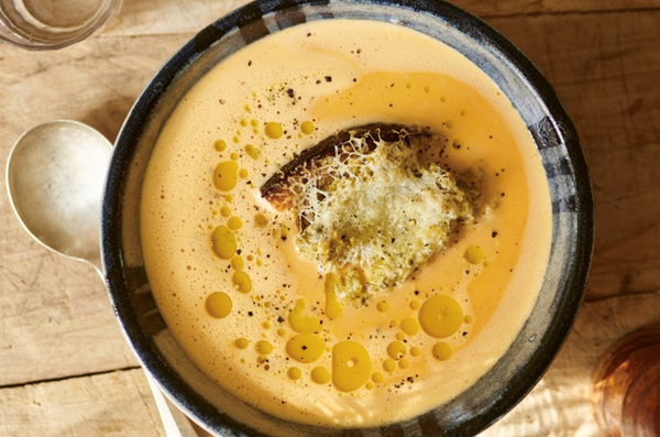 Creamy milk and roast garlic soup with Manchego and green olive toast