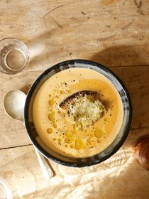 Creamy milk and roast garlic soup with Manchego and green olive toast