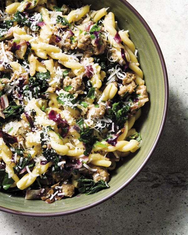 Creamy pasta with sausage and hardy greens