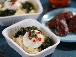 Creamy polenta with braised greens, poached eggs, and chile oil