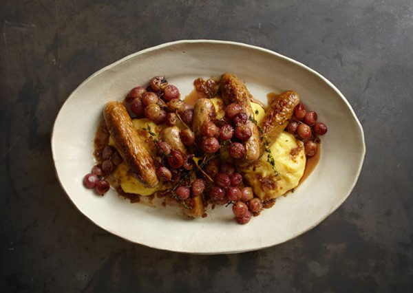 Creamy polenta with sausages and roasted grapes