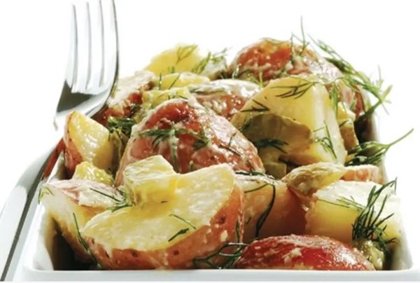 Creamy potato salad with dill pickles