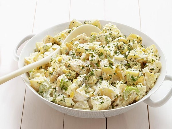 Creamy potato salad with herbs