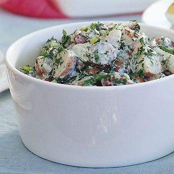 Creamy potato salad with lemon and fresh herbs