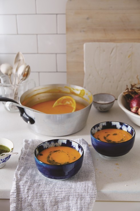 Creamy roasted carrot soup with pine nut and caper topping