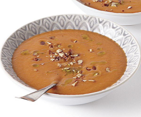 Creamy rutabaga and tomato soup with chive oil and smoked almonds