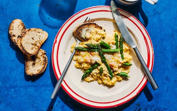 Creamy scrambled eggs with crab and asparagus
