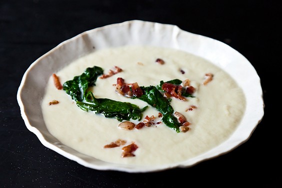 Creamy spring turnip soup with wilted radish greens and bacon