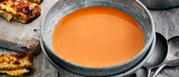 Creamy tomato soup with cheese and Marmite dippers