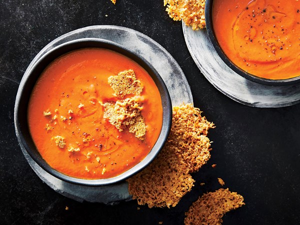 Creamy tomato soup with Parmesan crisps