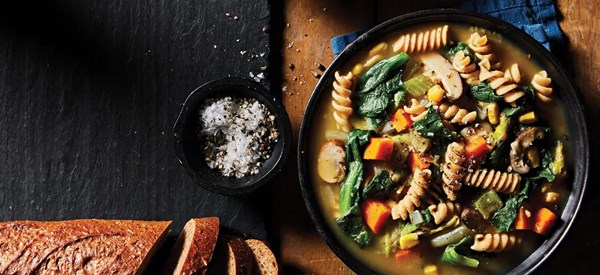 Creamy vegetable noodle soup with escarole 