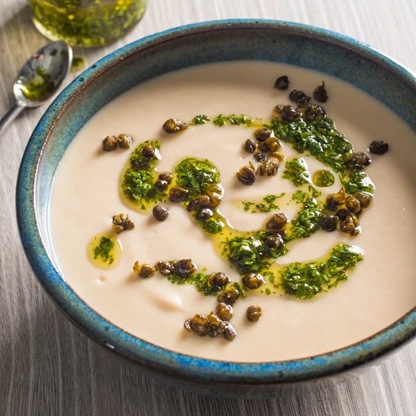 Creamy white bean soup with crispy capers
