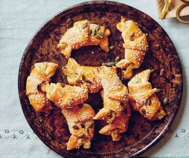 Crescent-moon pastries with herby curd filling
