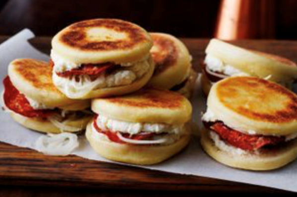 Crescentina with whipped ricotta, sweet and sour onions and crispy salami
