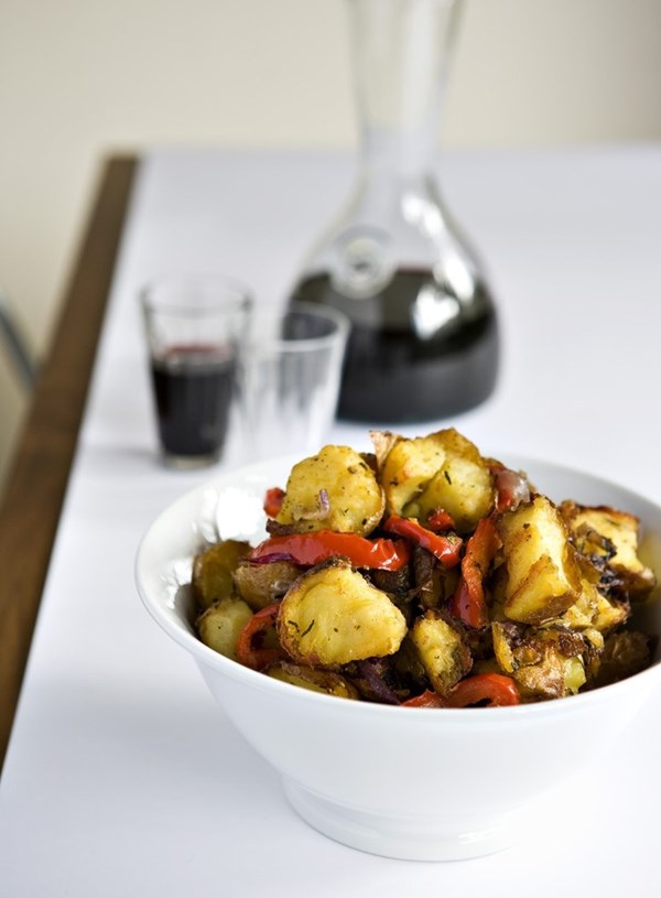 Crisp baked potatoes with red capsicum