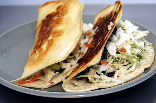 Crisp black bean tacos with feta and slaw