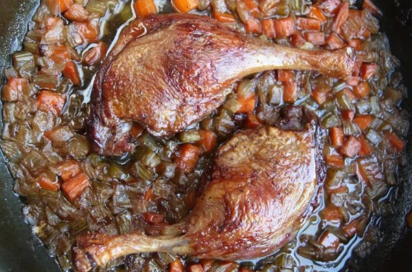 Crisp-braised duck legs with aromatic vegetables