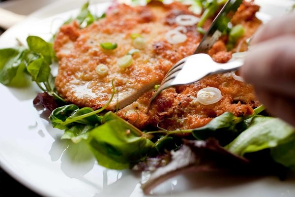 Crisp chicken schnitzel with lemony herb salad