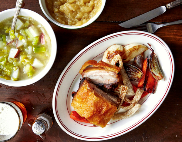 Crisp pork belly with roasted vegetables and applesauce
