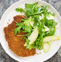 Crisp pork cutlets with arugula and apple salad