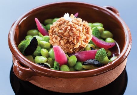 Crisp risotto balls with mushrooms, broad beans, and mussel powder