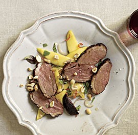 Crisp tea-smoked duck with green mango and basil salad