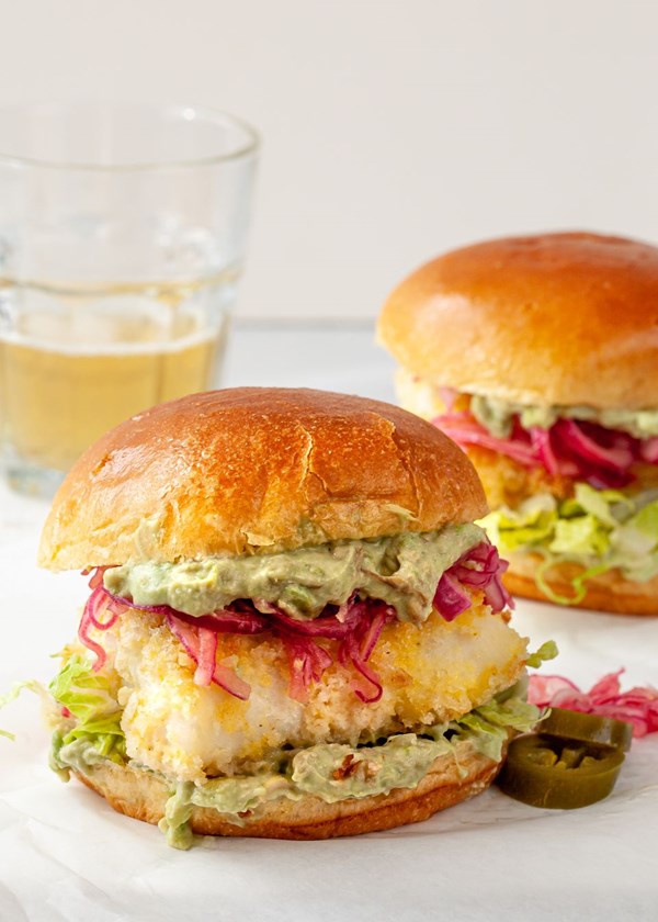 Crispy baked fish sandwiches with avocado mayo and pickled onion