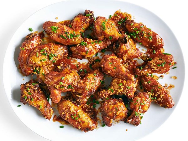Crispy baked wings with berbere honey glaze and fried garlic