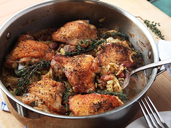 Crispy braised chicken thighs with cabbage and bacon