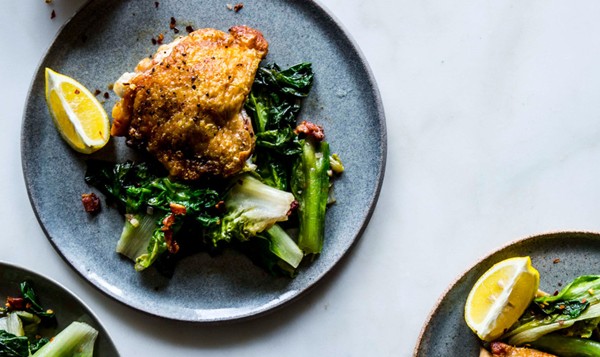 Crispy chicken thighs with bacon and wilted escarole