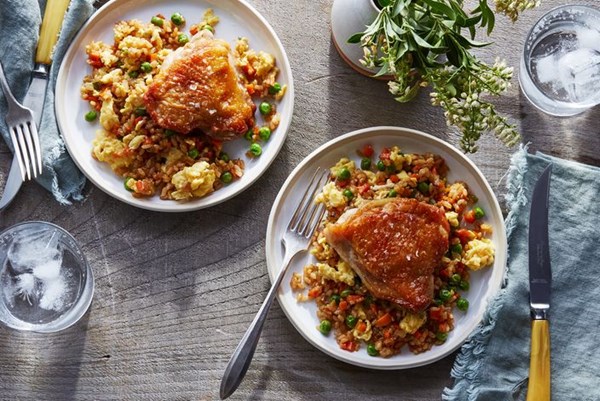 Crispy chicken thighs with chicken-fat fried rice 