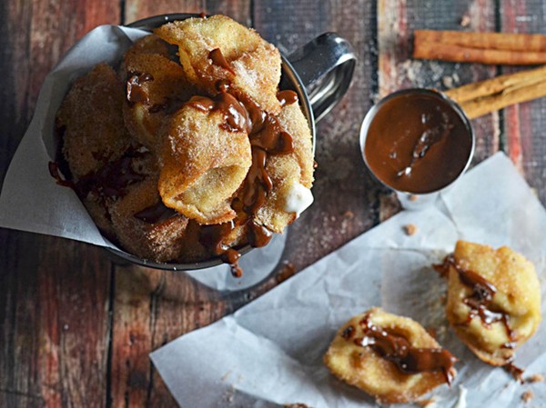 Crispy cinnamon sugar-coated cream cheese wontons with Nutella-dulce de leche dipping sauce