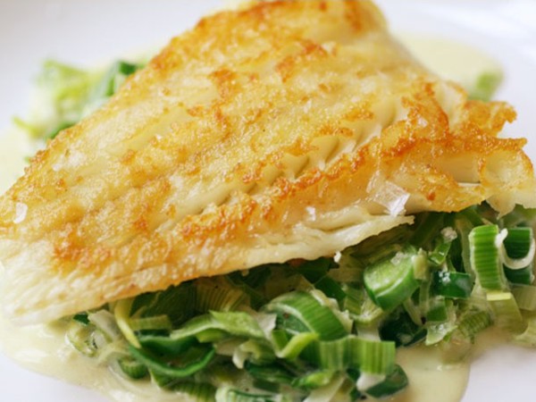 Crispy cod cooked 'unilaterally' with creamed leeks