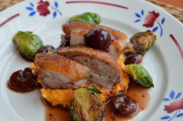 Crispy duck breasts with balsamic-cherry sauce, roasted Brussels sprouts, parsnip-carrot puree