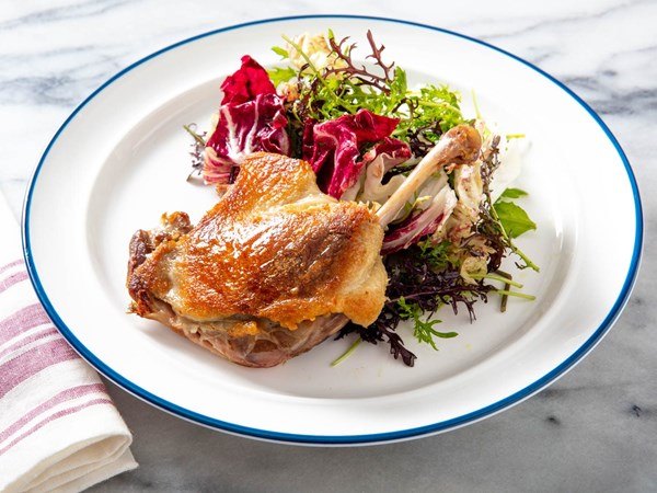 Crispy duck confit with mixed bitter greens salad