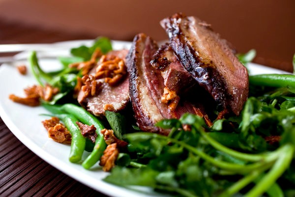 Crispy duck salad with green beans and honeyed almonds