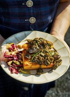 Crispy edged polenta with creamy tarragon mushrooms & bitter leaf salad