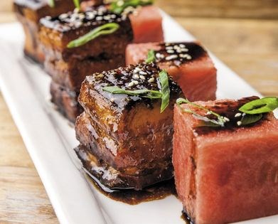 Crispy fried bacon pork belly and watermelon salad with balsamic soy glaze