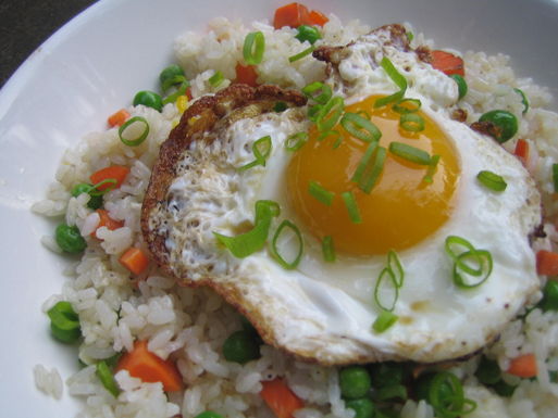 Crispy fried eggs on garlic fried rice