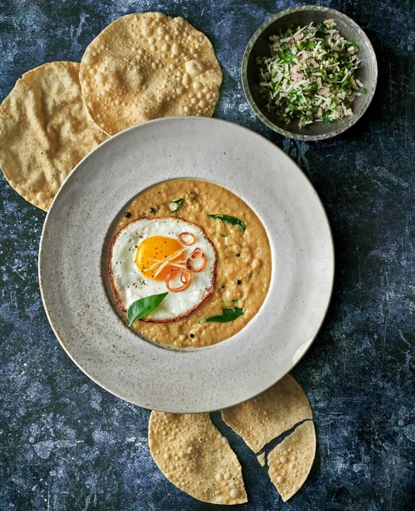 Crispy fried eggs with coconut curry and coriander sambol